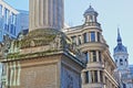 Close-up on the Monument to the great fire in London surrounded by modern buildings in the financial district of the City of Londo